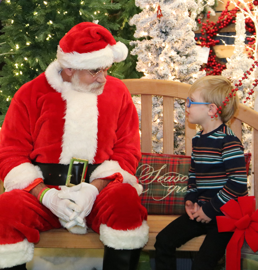 Santa with a Child at Down to Earth